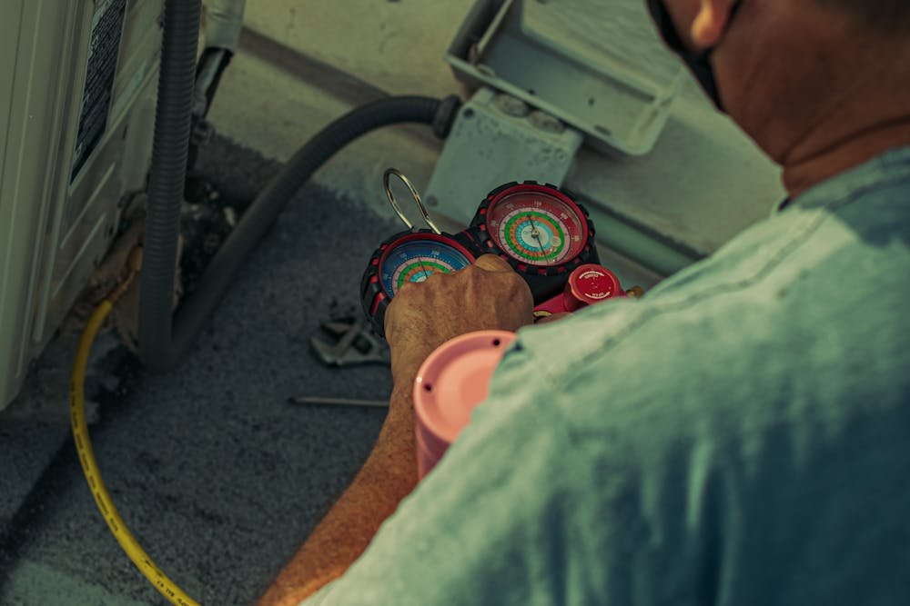 a man doing an AC checkup